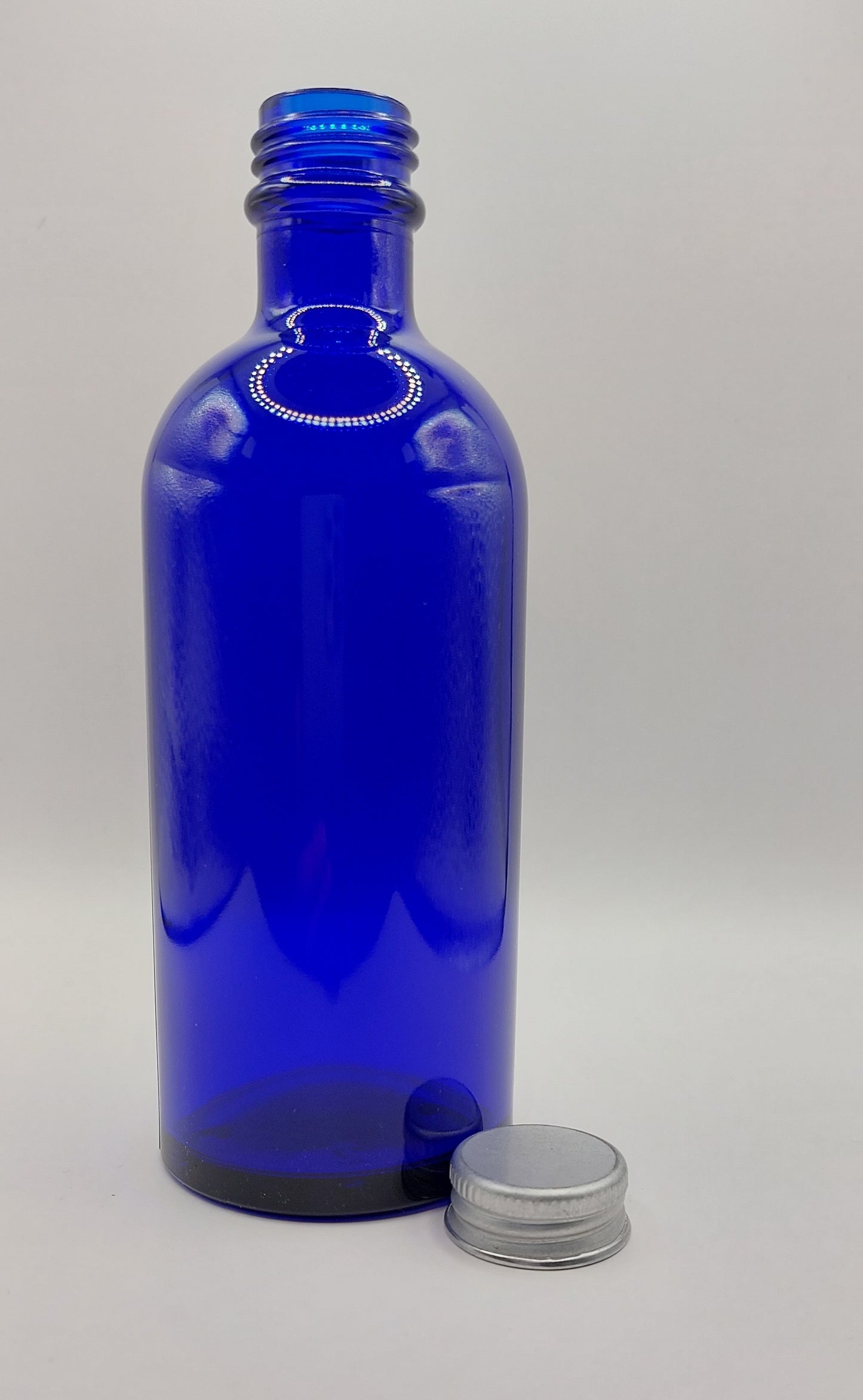 FLACON VERRE BLEU 100ML + CAPSULE