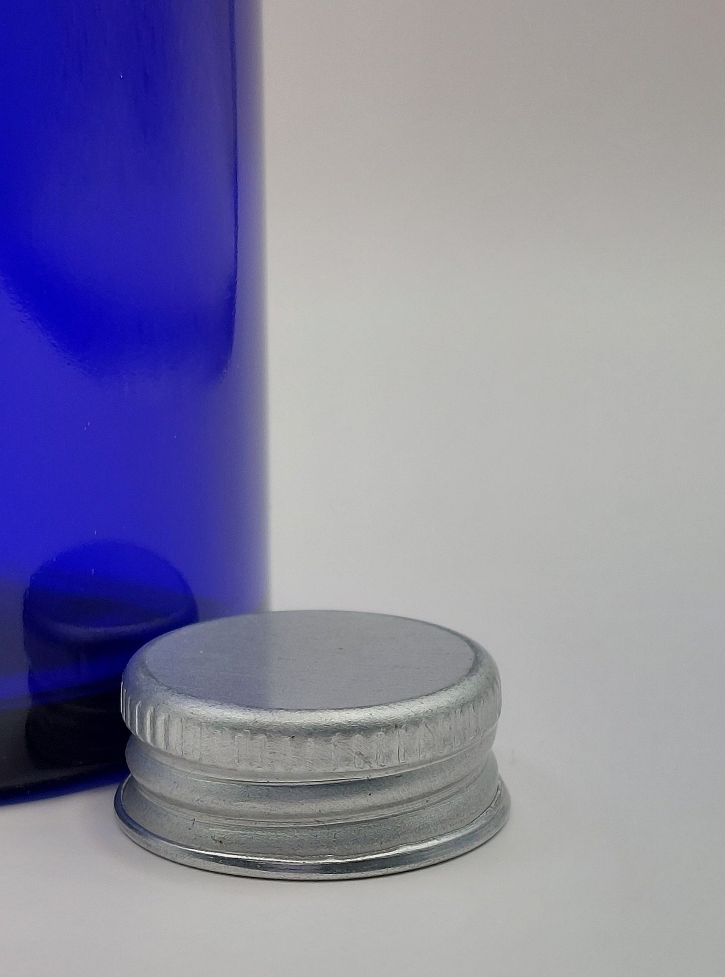 FLACON VERRE BLEU 100ML + CAPSULE