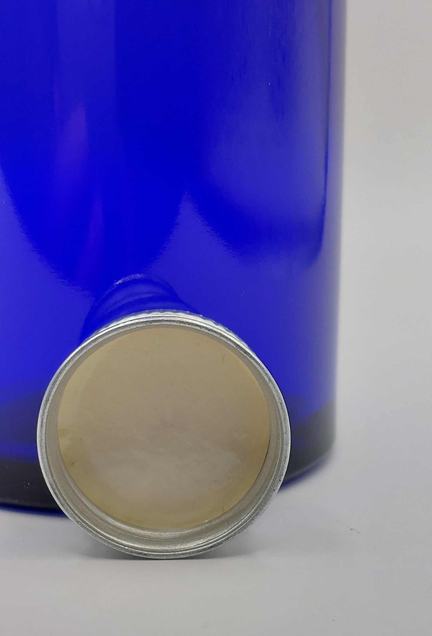 FLACON VERRE BLEU 100ML + CAPSULE
